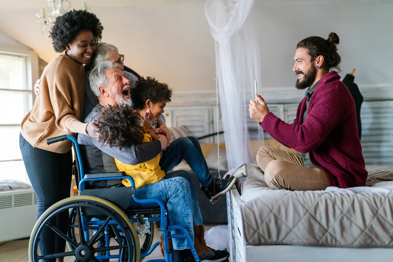 A group of people sitting around in wheelchairs.